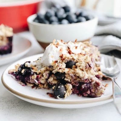 Change up your breakfast game with this Blueberry Coconut Baked Oatmeal. An easy, vegan, breakfast option that you can bake ahead of time for weekday breakfasts or fresh for a fancy weekend brunch.