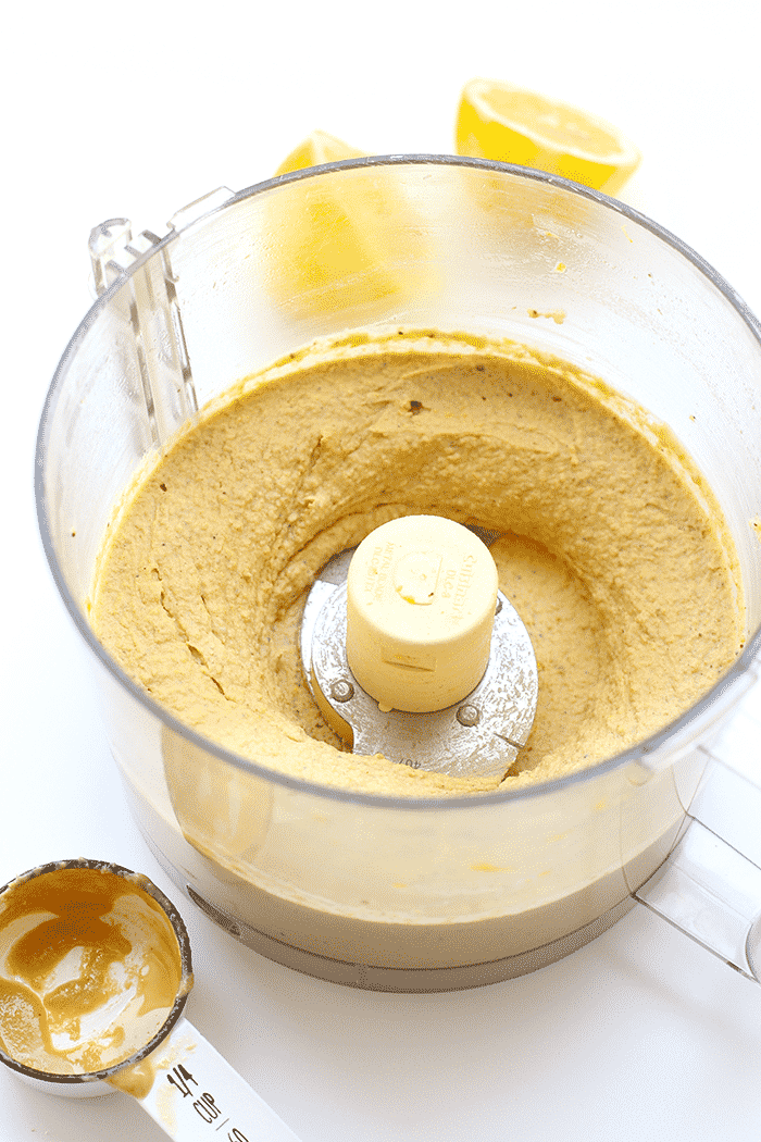 Lemon hemp hummus blended in a food processor.