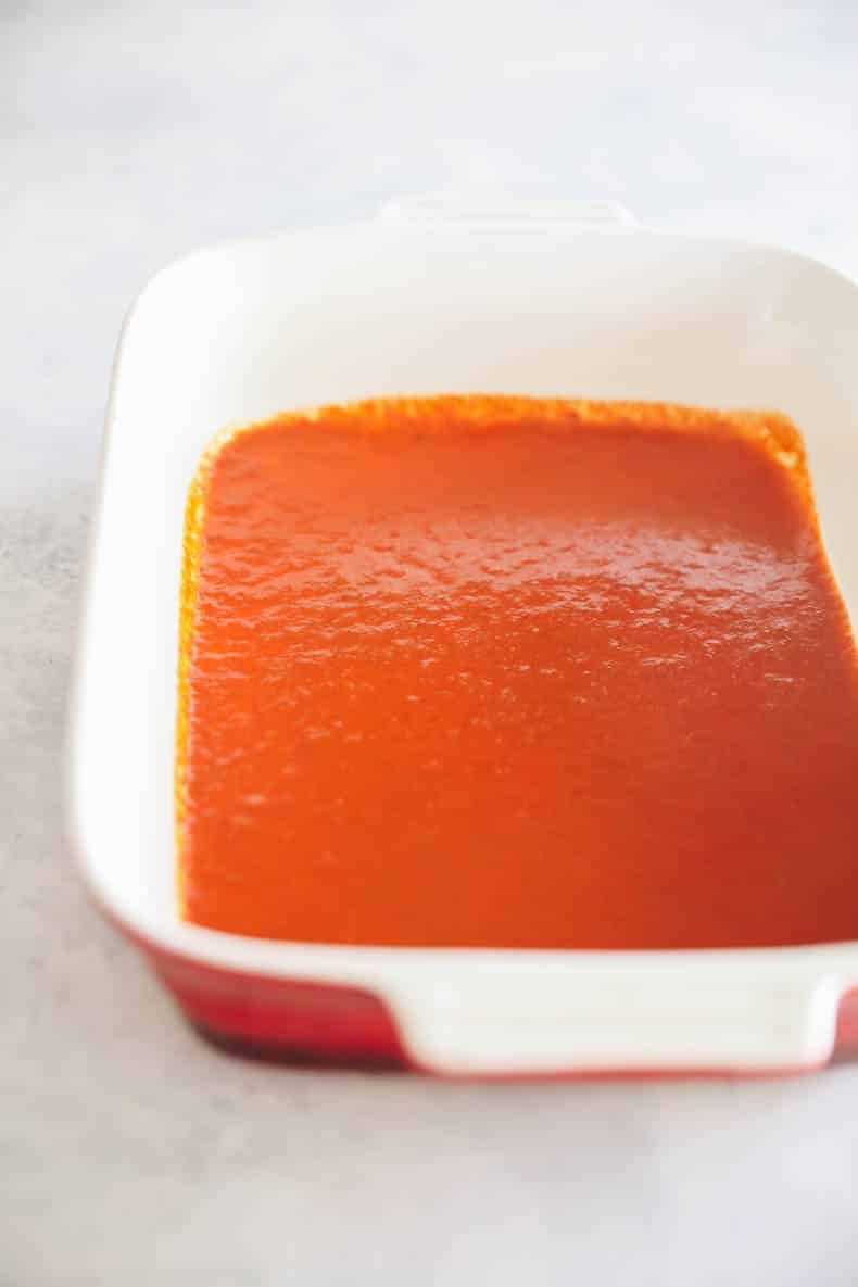 Enchilada sauce in baking dish