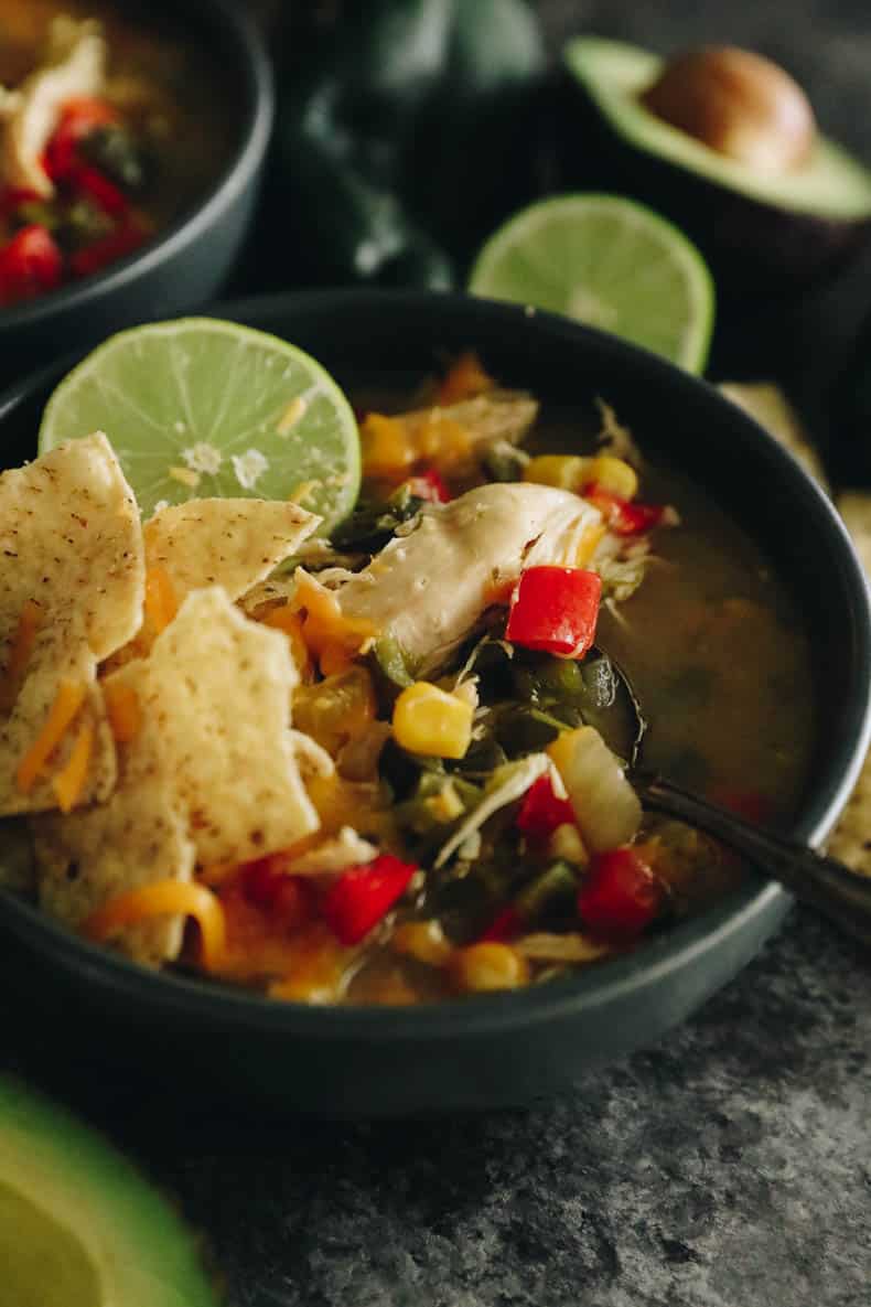 up close image of soup in a blue bowl.