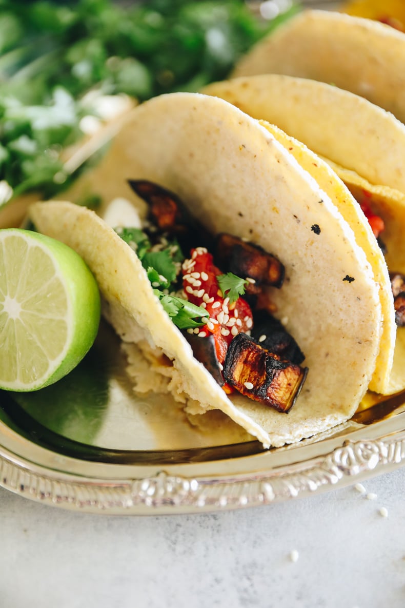 Roasted eggplant tacos on a silver tray