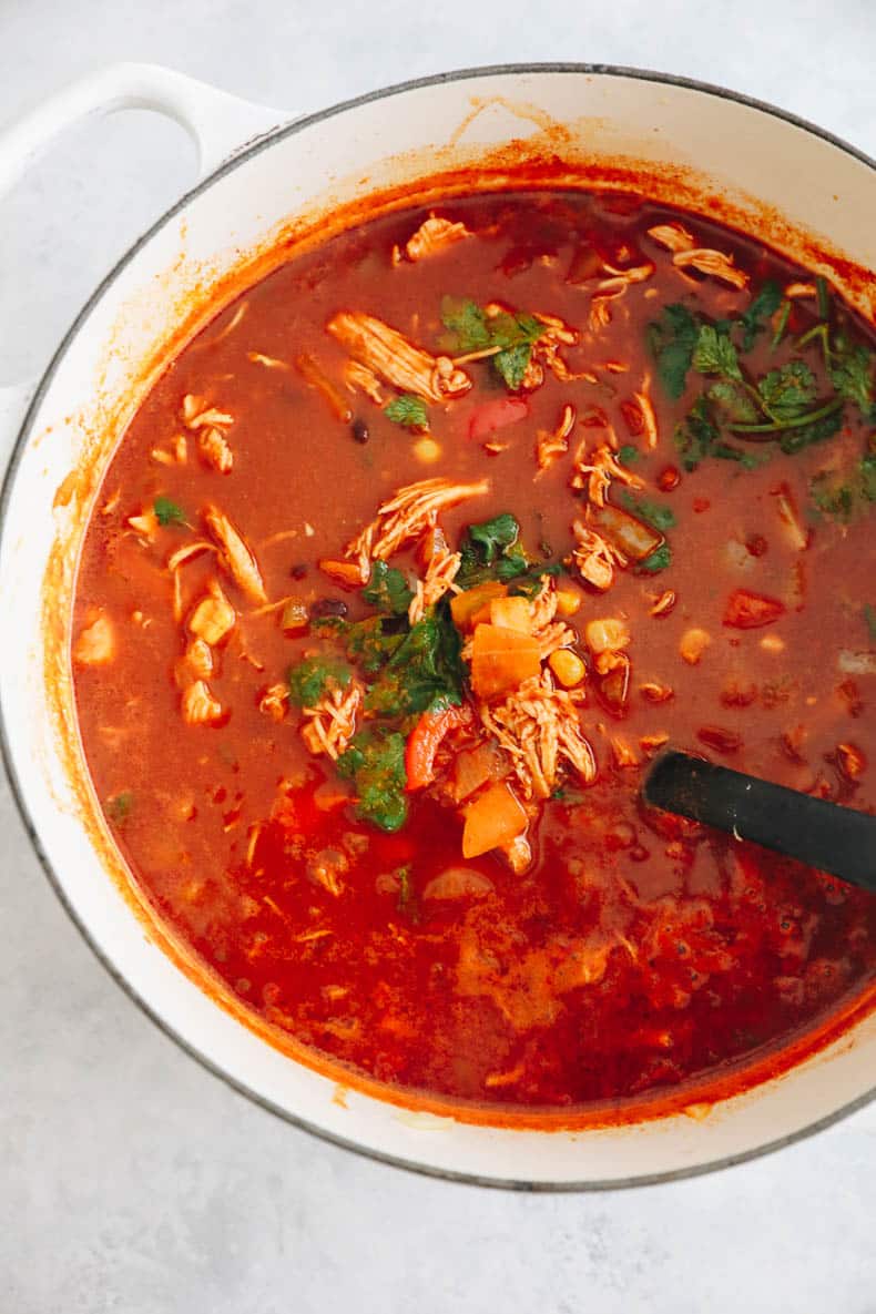 big dutch oven filled with chicken enchilada soup/