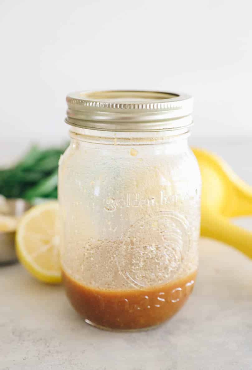 dressing for green bean salad in a small mason jar.