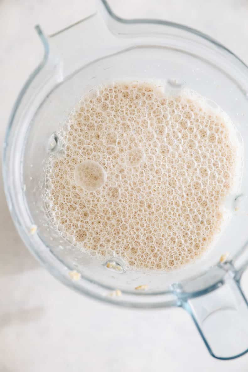 blended oats in a blender for homemade oat milk