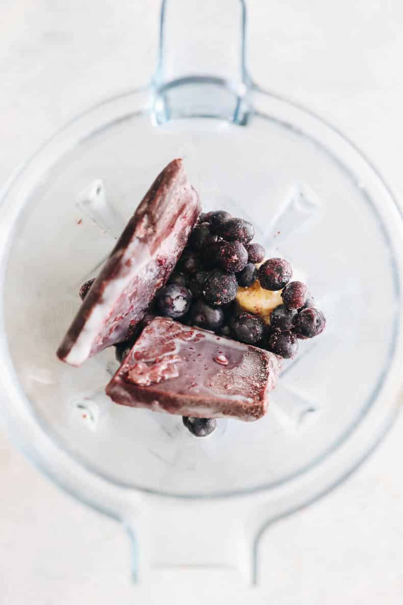 Acai bowl ingredients in a blender.