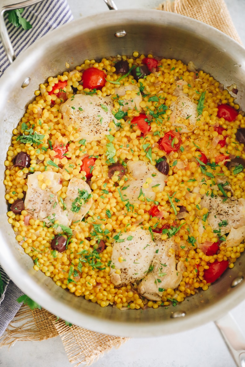 one-pot recipe for israeli couscous with chicken thighs. 