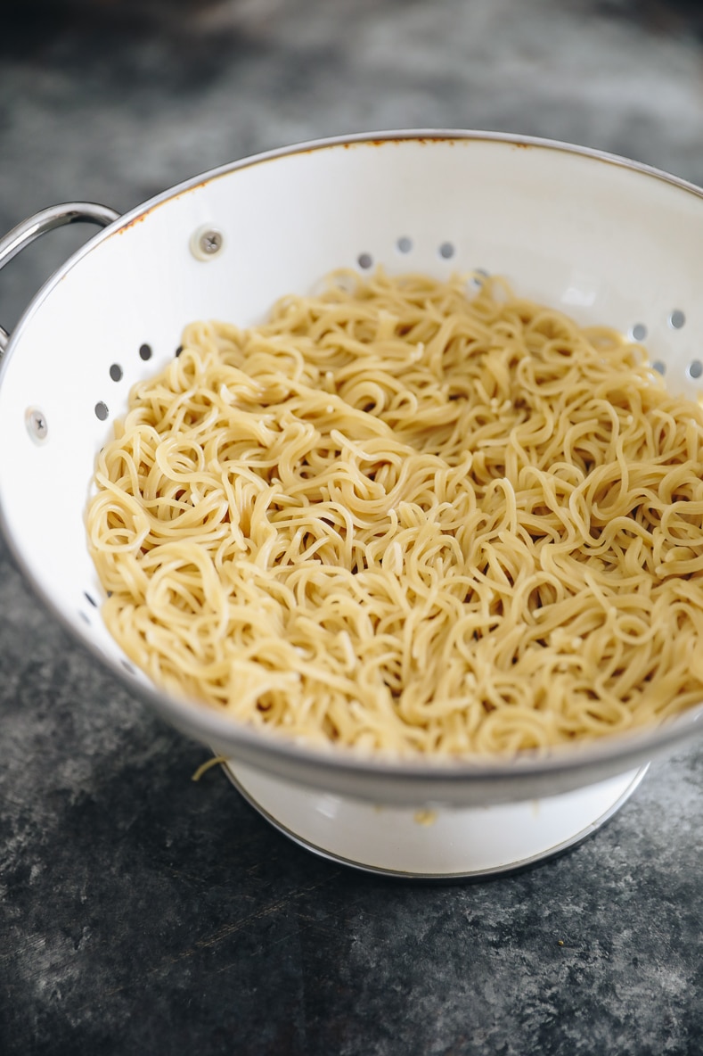 cooked ramen noodles in a colander.