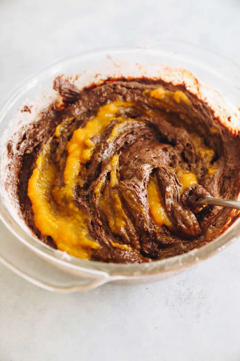 Pumpkin Brownie Batter in a glass mixing bowl.