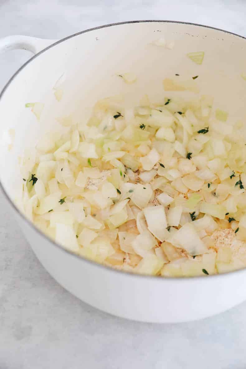 Onion and thyme cooked in a pot