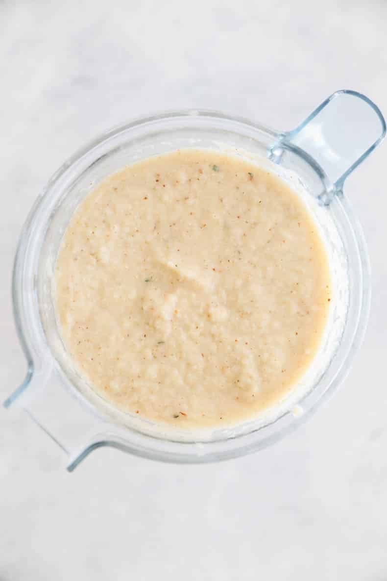 roasted cauliflower soup blended up in a blender.