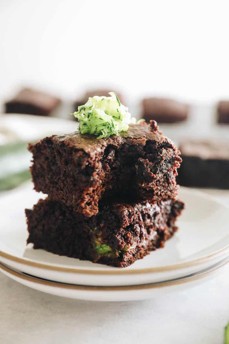 zucchini brownies with a bite taken out of it.